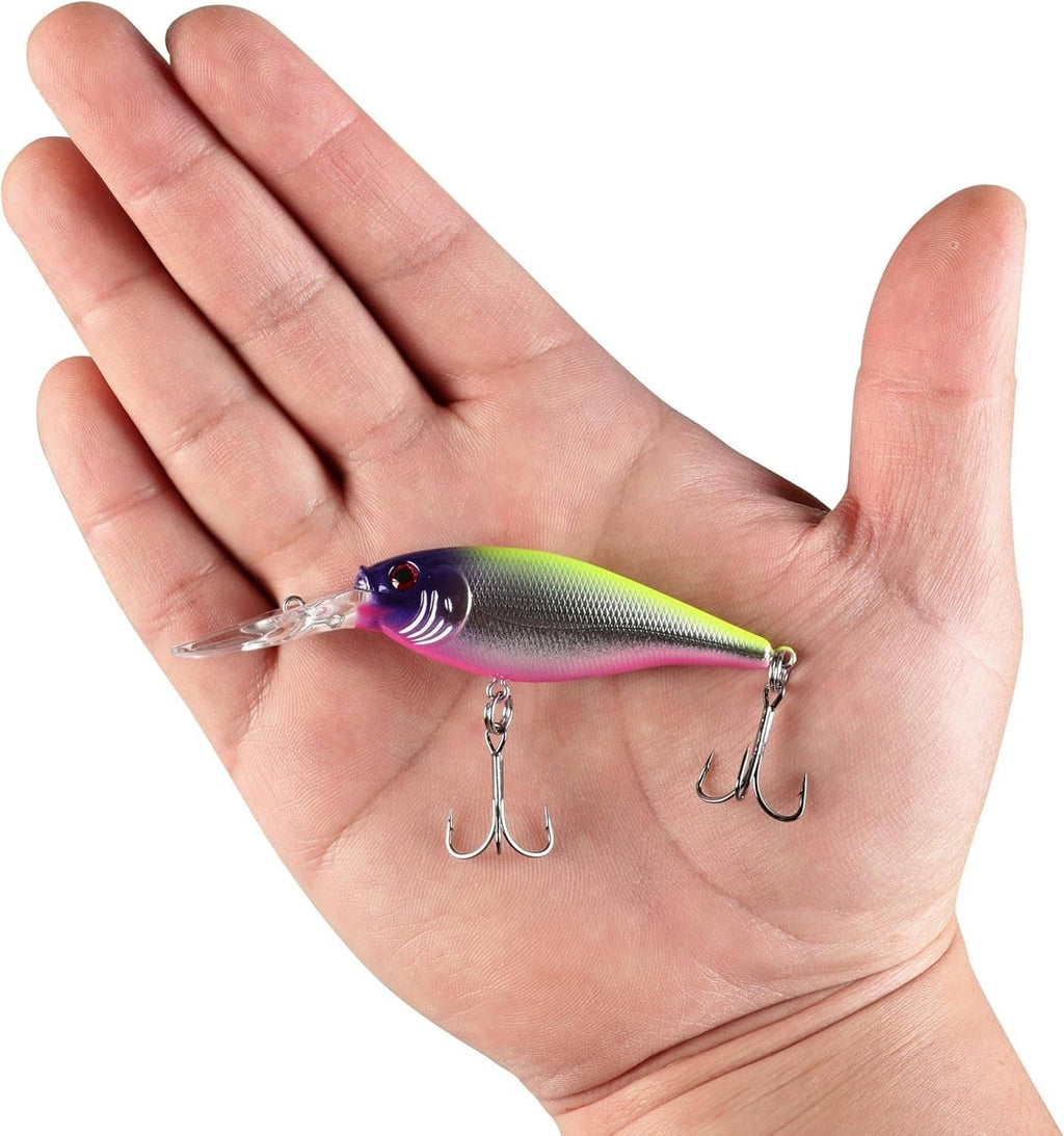 Crankbait fishing lure in hand: chartreuse-green and purple with pink belly and treble hooks