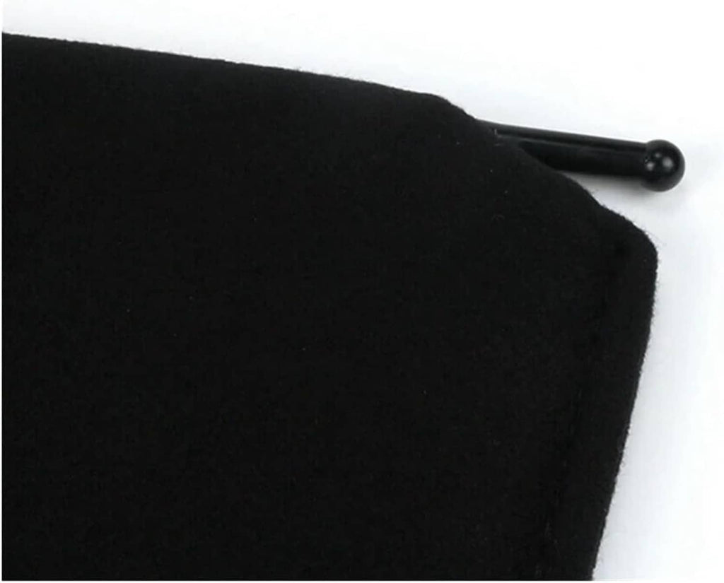 Black padded edge of a car sun visor with mounting arm partially visible