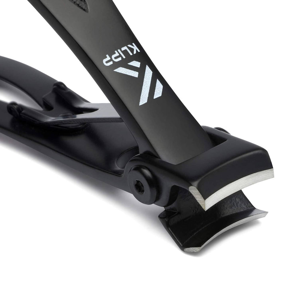 Black toenail clippers close-up, curved blades and cutting edge