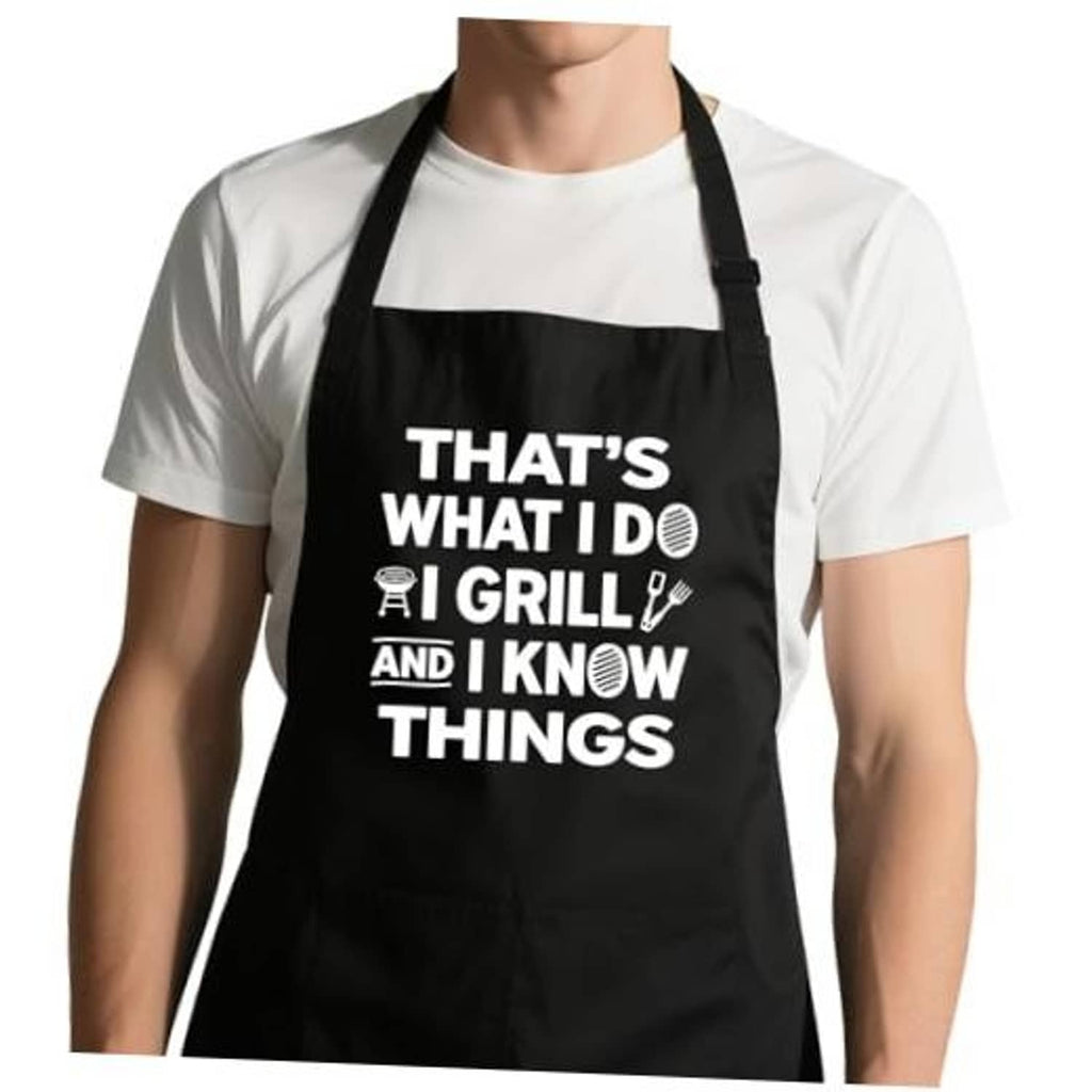 Black grilling apron with white humorous text, adjustable neck strap, 2 front pockets