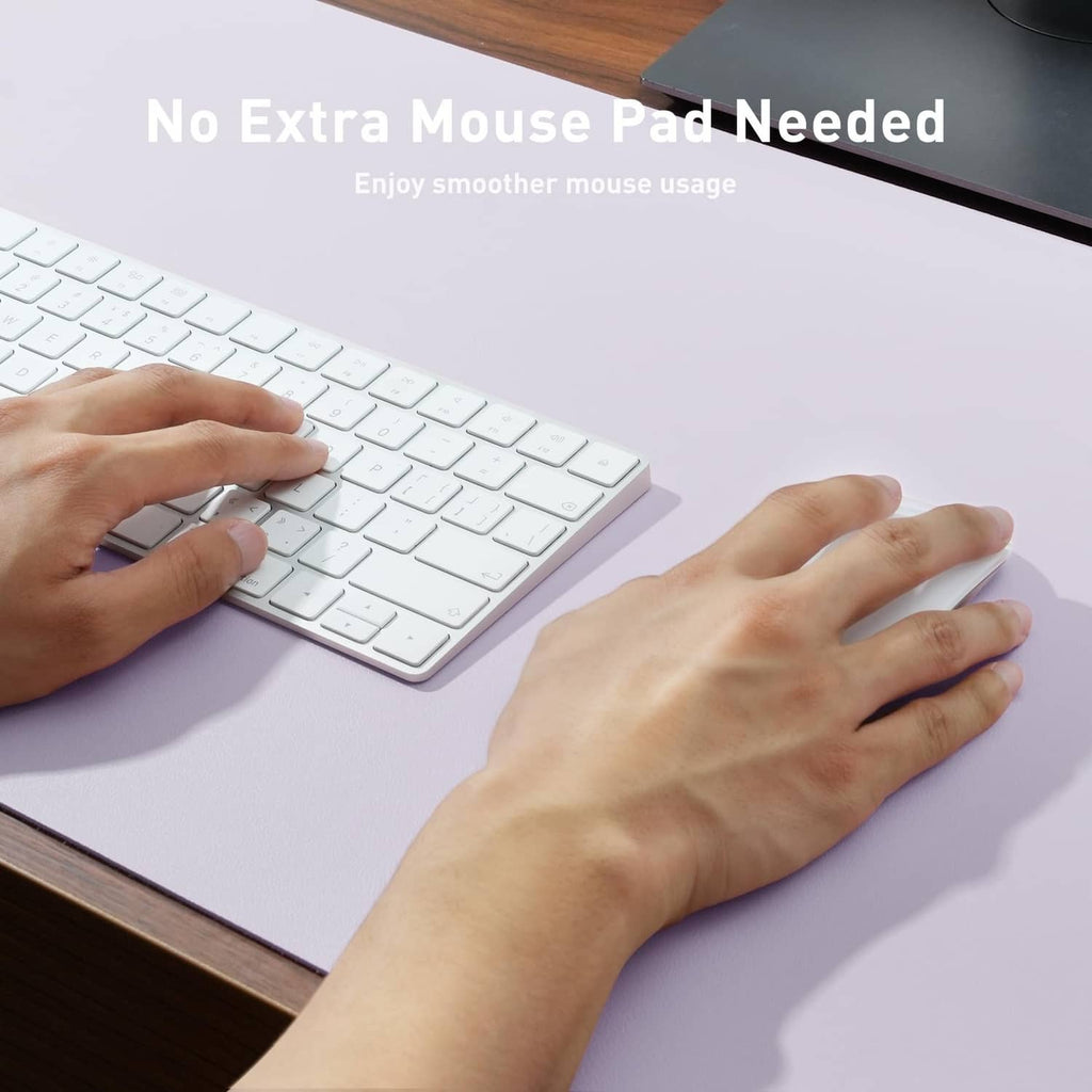 Lavender PU leather desk pad protector being smoothed by hands on a desk
