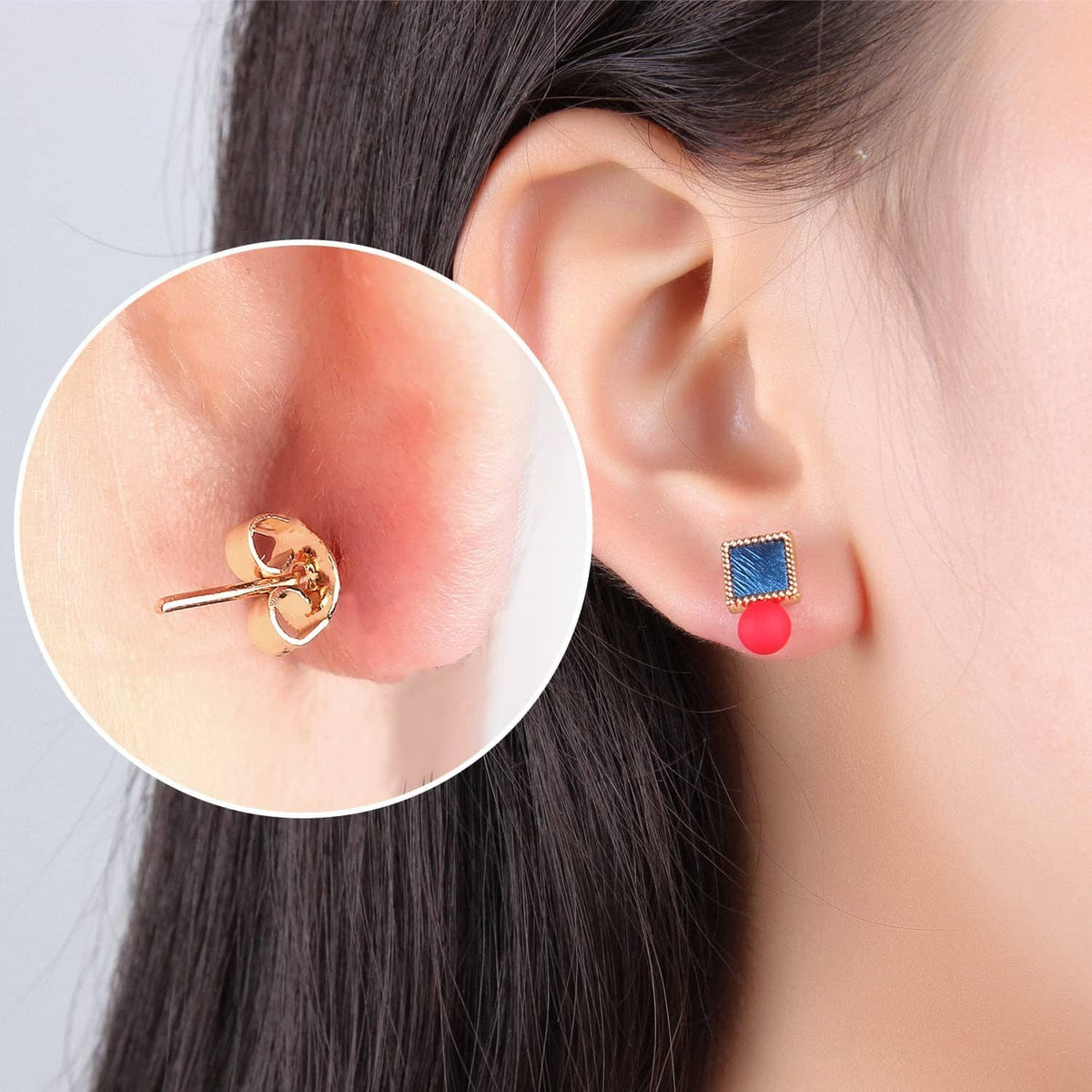 Gold butterfly earring back holding a stud earring on ear