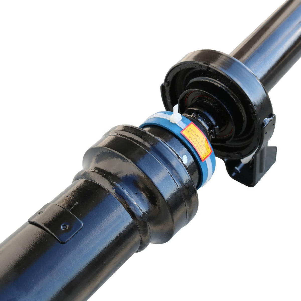 Drive shaft assembly end with black housing, blue shaft, and wiring connector