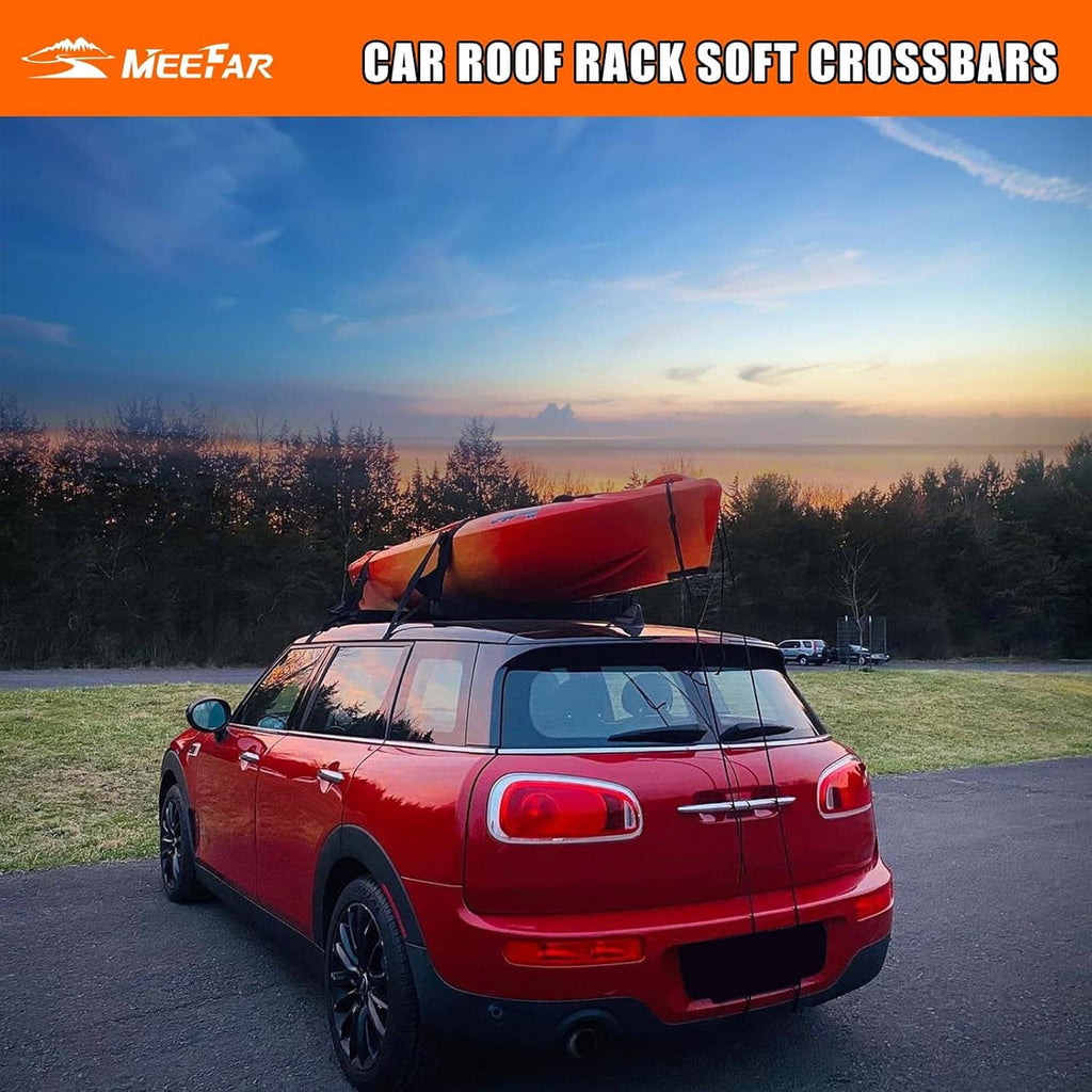 Soft black roof rack crossbar pads secured on a vehicle roof for water sports gear
