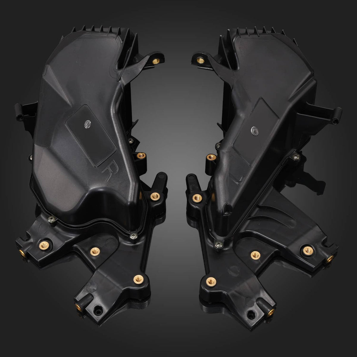 Pair of black glove box storage housings with vents and metal mounting points
