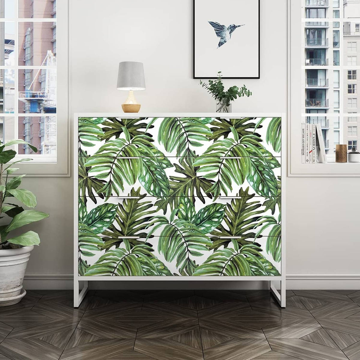 Tropical palm leaf peel-and-stick wallpaper covering a wall with repeating green leaf motif