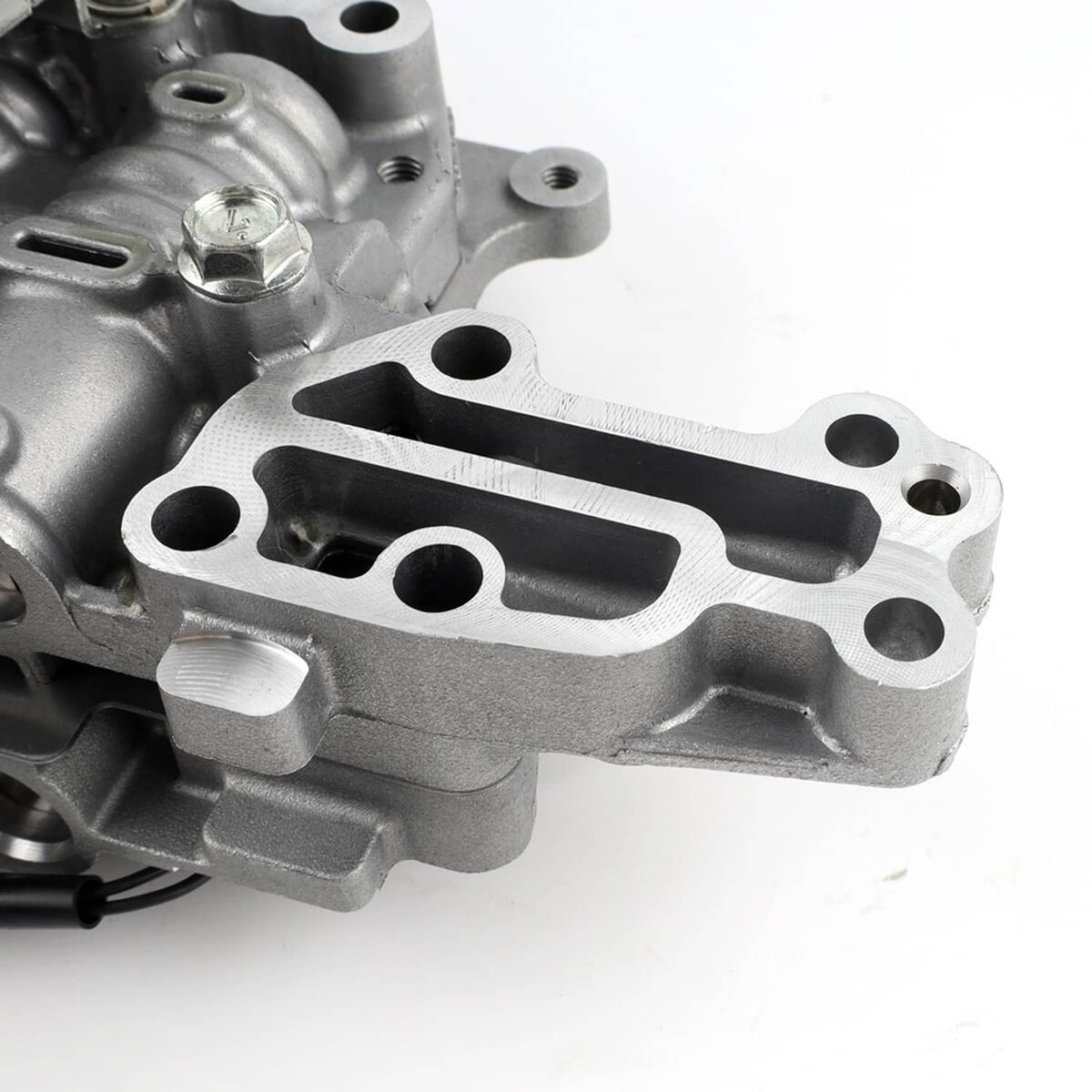 Machined metal bracket section of CVT transmission valve body