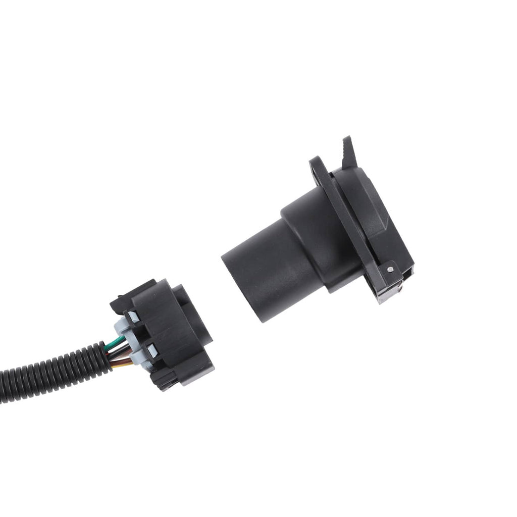 Black plastic connector pair with latch tabs on wiring harness