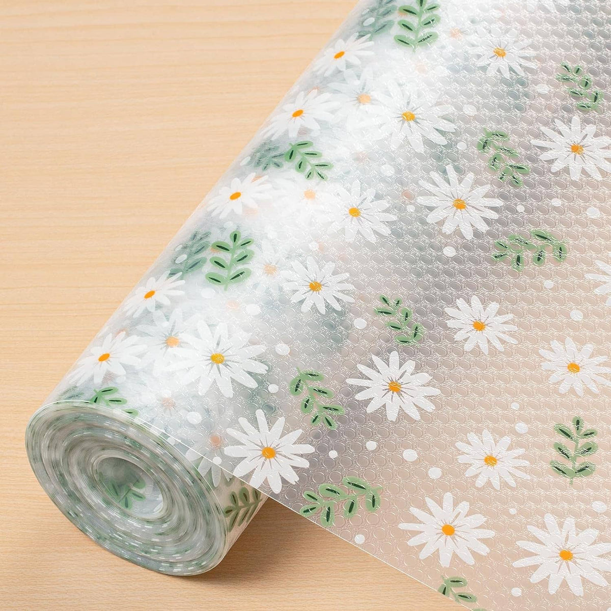 Rolled shelf liner with white daisy flowers and green leaves pattern