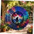 Colorful hanging wind spinner with Bigfoot silhouette, moon, and pine trees sky design