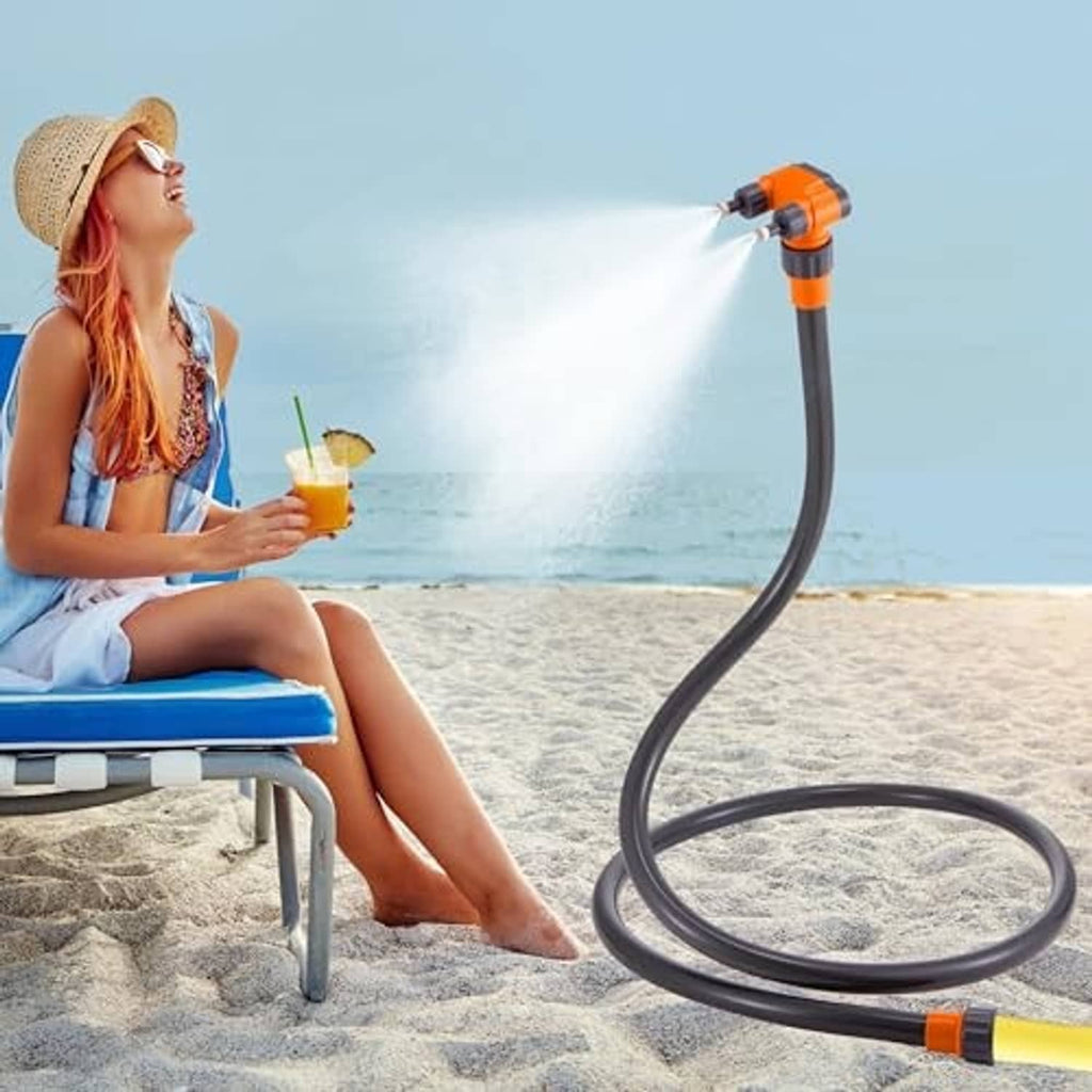 Standing patio misting nozzle with flexible black hose and orange accents, spraying mist
