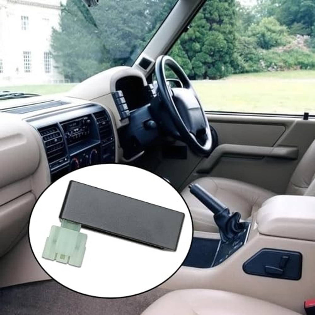 Ignition module insert on car center console, dark gray box with green connector plug