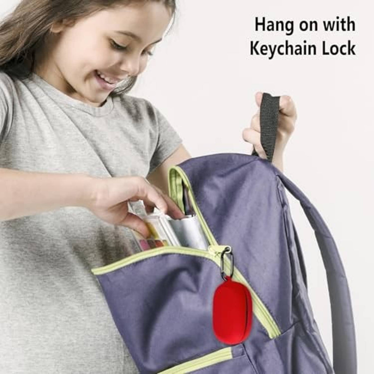 Red silicone earbud case hanging on a keychain lock attached to a backpack
