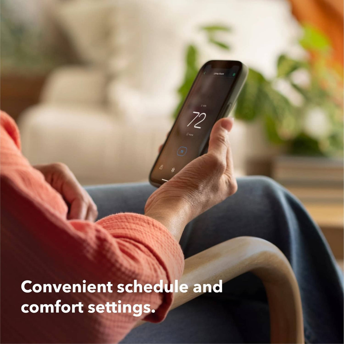 Smartphone app displaying 72° temperature while controlling a home thermostat
