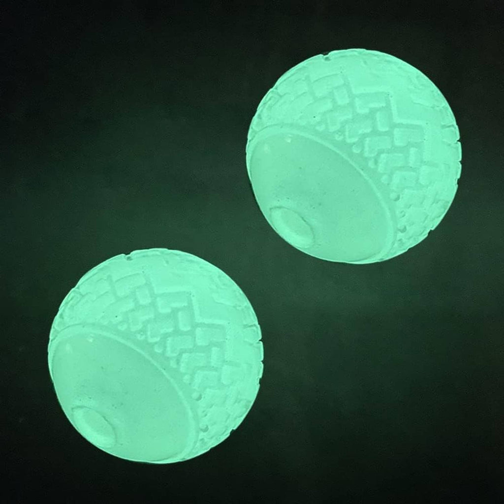 Two mint-green glow ball dog toys with textured outer surface and rounded hollow center.
