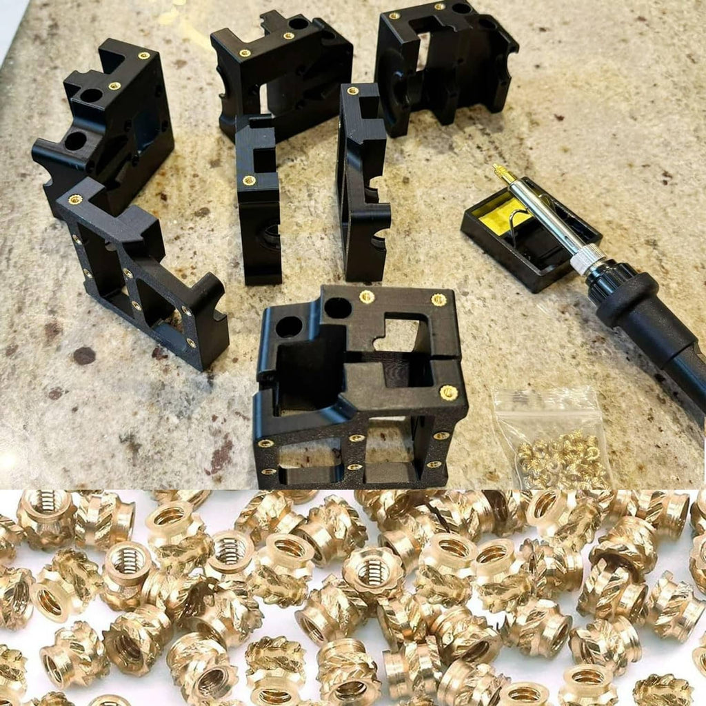 Brass heat-set inserts with black alignment jigs and handheld soldering iron tool