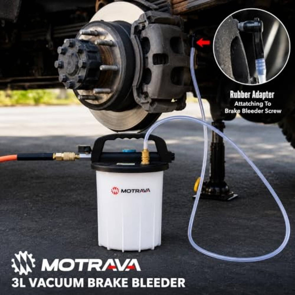 Vacuum brake bleeder connected to vehicle brake with vacuum hose and bottle unit