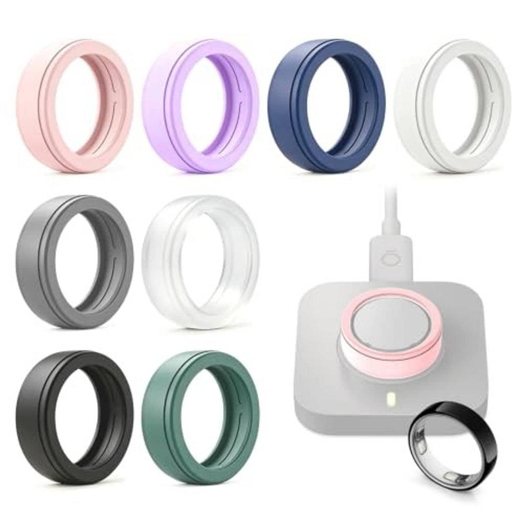 Silicone smart ring covers in assorted colors with a charging base and ring shown