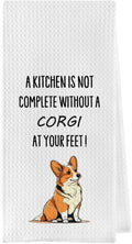 White waffle weave kitchen towel with corgi illustration and quote: “A kitchen is not complete”.