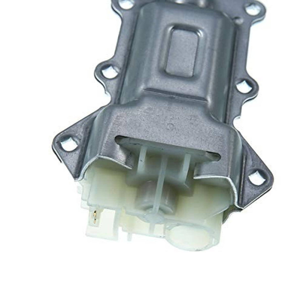 Close-up of power window motor connector and mounting base, gray metal and white plugs