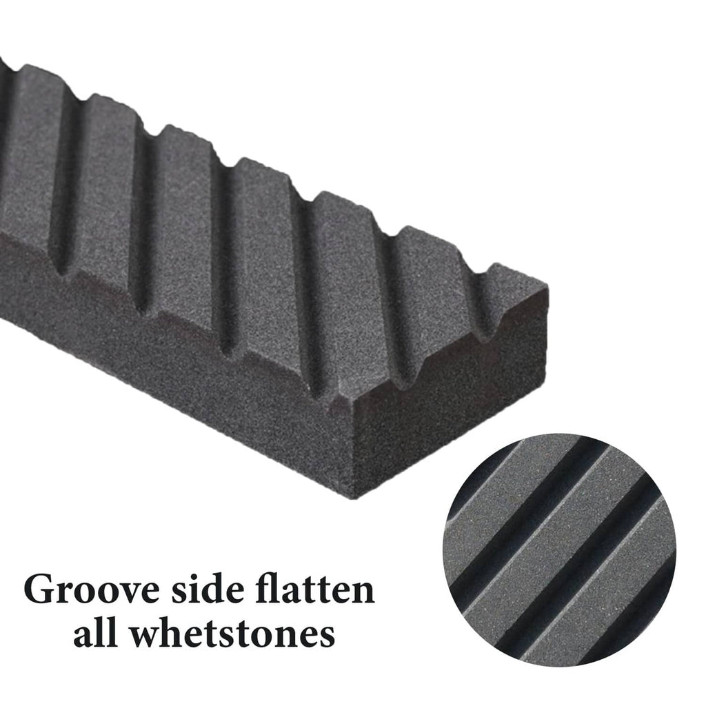 Black whetstone with deep parallel grooves and textured gritty finish