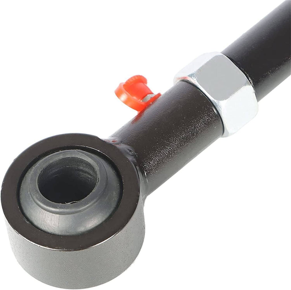 Close-up of black sway bar link end bushing with red retaining clip