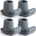 Four gray walker ski glides with smooth curved runner and cup-shaped top