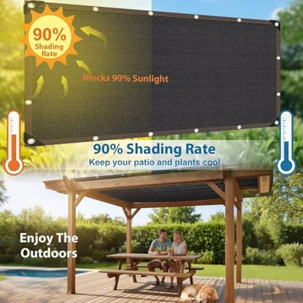 Black shade cloth panel stretched with grommet corners on a patio pergola frame.