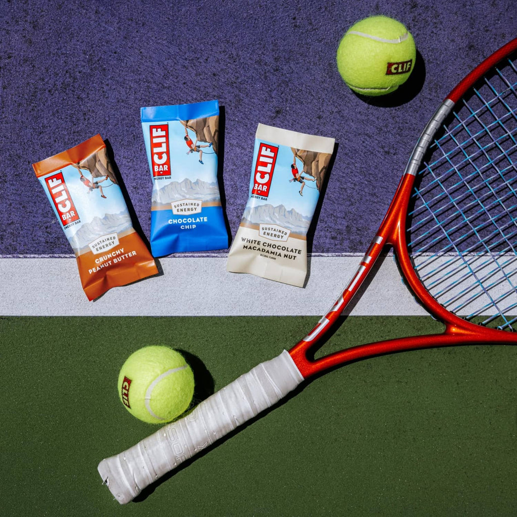 CLIF BAR Protein Energy Bar wrappers, assorted flavors on sports court