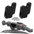 Pair of black handlebar riser brackets with mounting screws and installed on handlebars