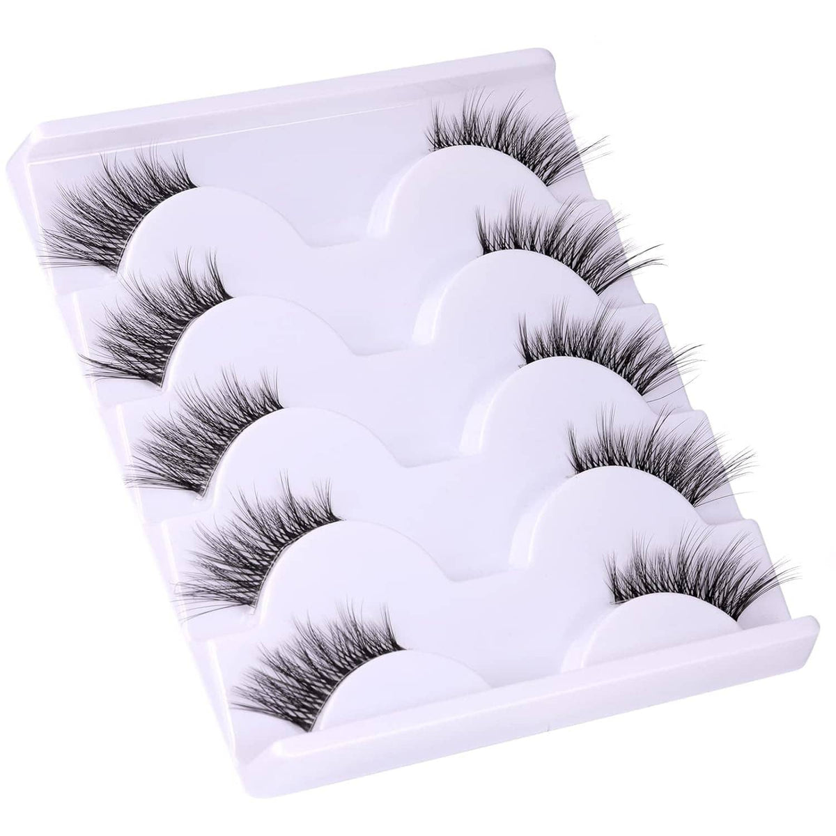 Wispy 3/4 false eyelashes with clear band, multiple pairs arranged on a plastic tray