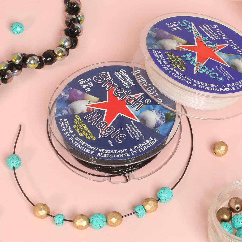 Elastic beading cord spool with several strands and bead cord bracelets on display