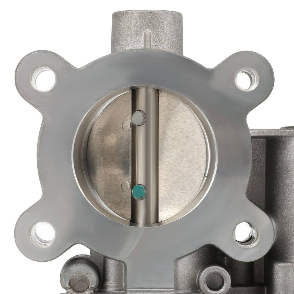 Throttle body showing circular intake opening with metal valve stem and sensor ports