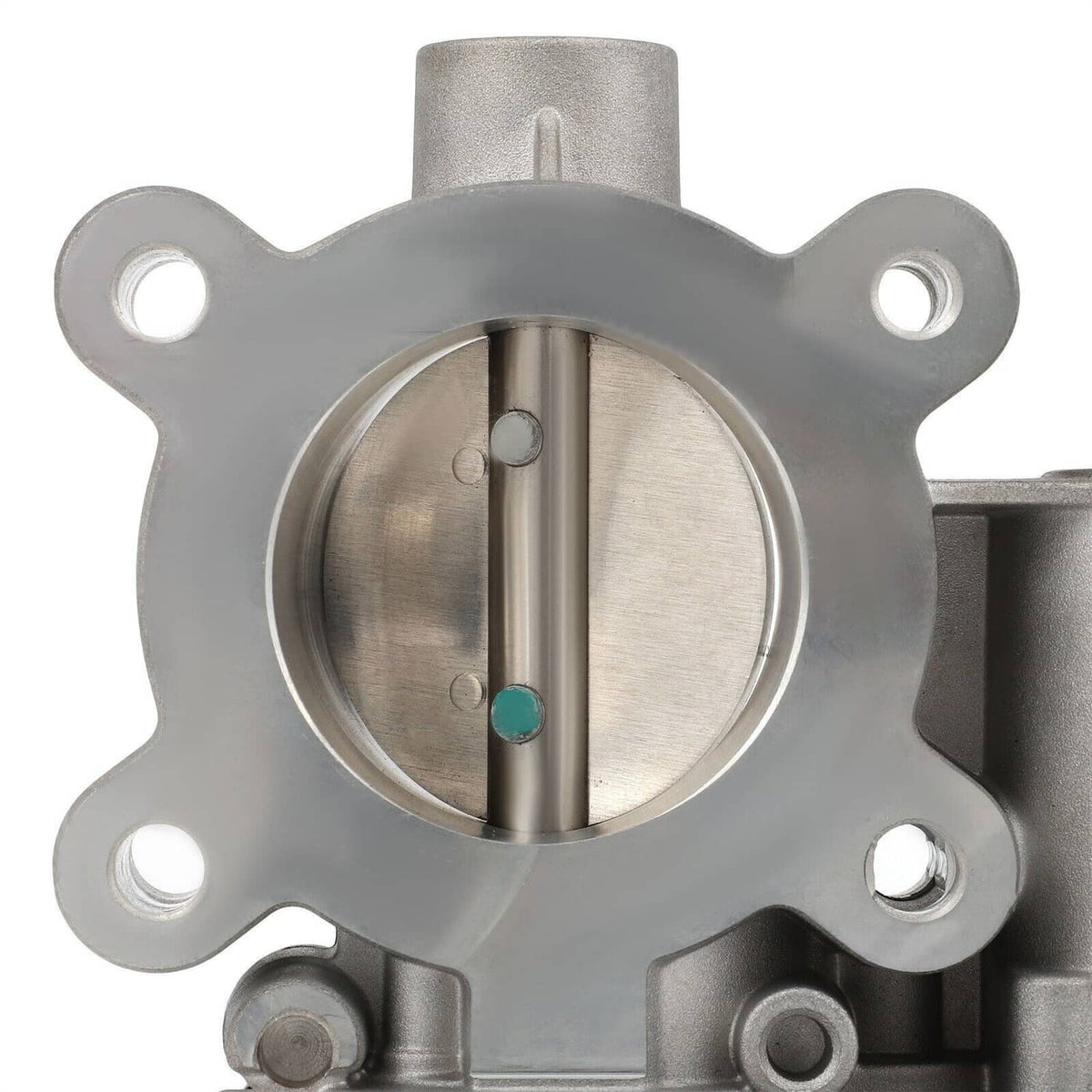 Throttle body showing circular intake opening with metal valve stem and sensor ports