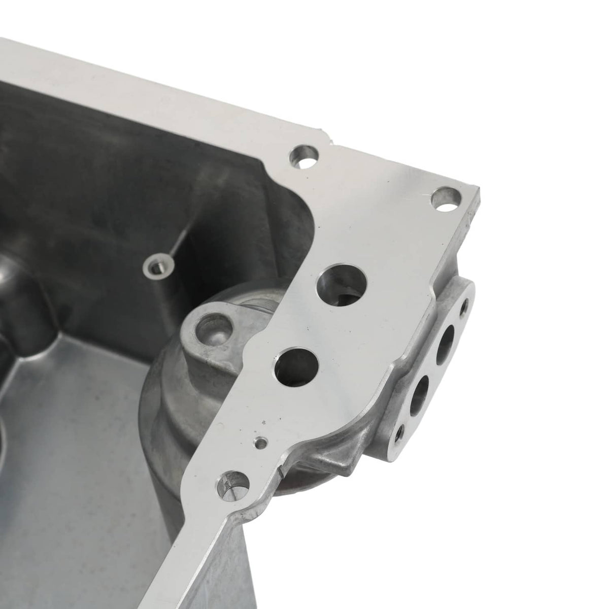 Engine oil pan kit baffle plate with bolt holes and circular cutouts in metal