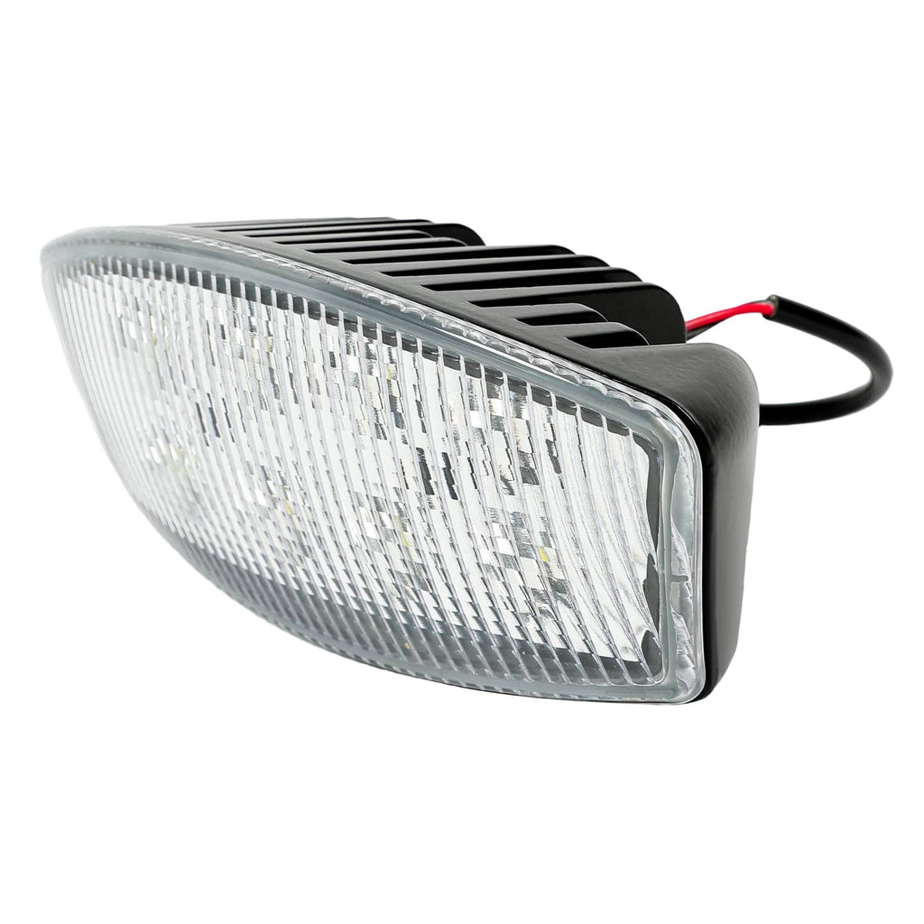 LED cab roof marker light angled view with clear lens, black fins, and attached wire