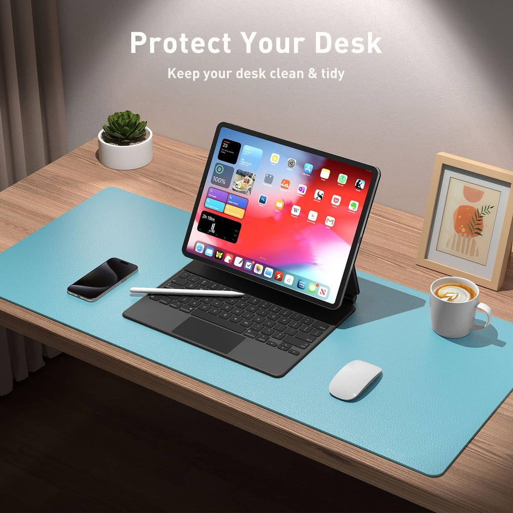 Blue topaz PU leather desk pad protector protecting a work desk