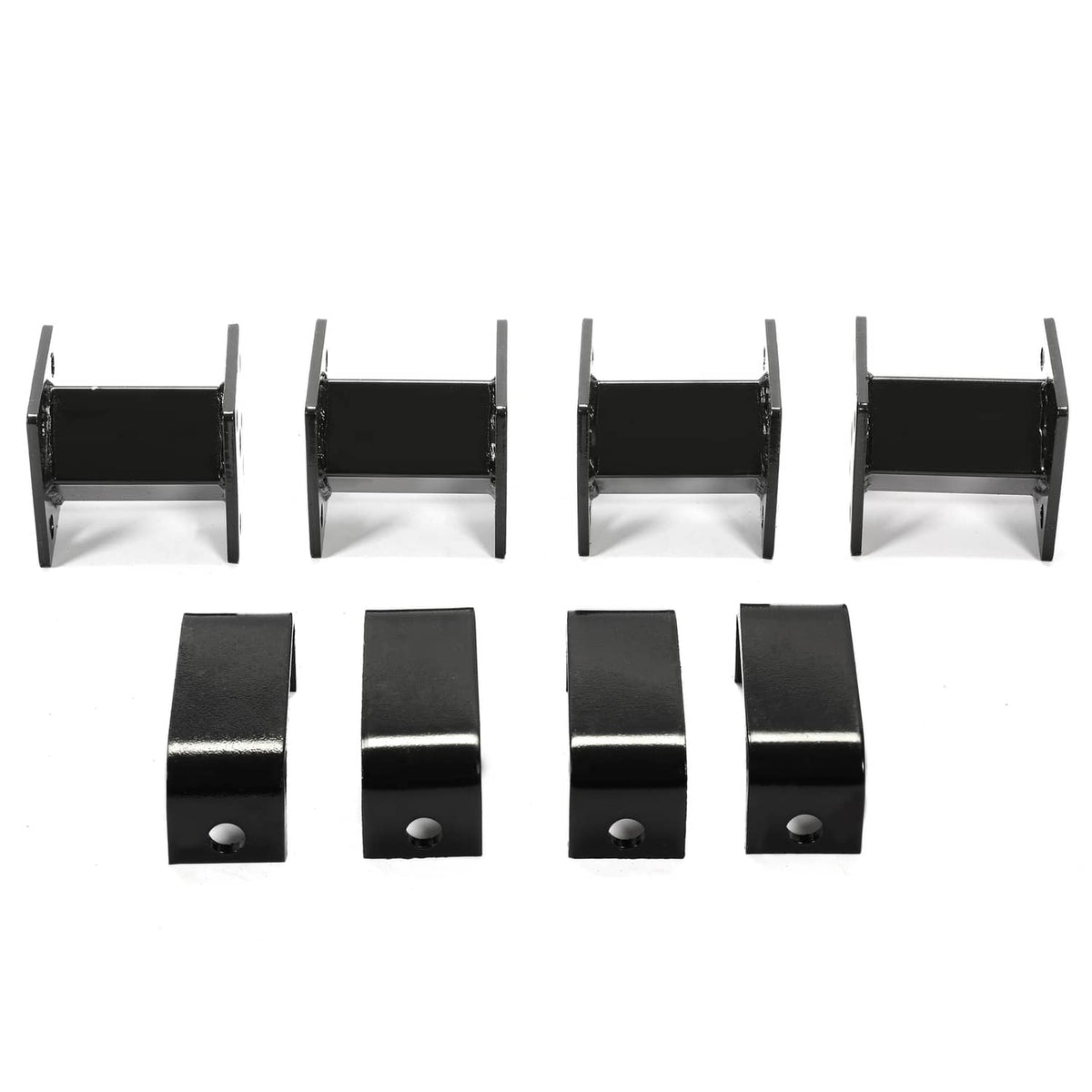 4-inch block lift kit components: black brackets and spacers with bolt holes