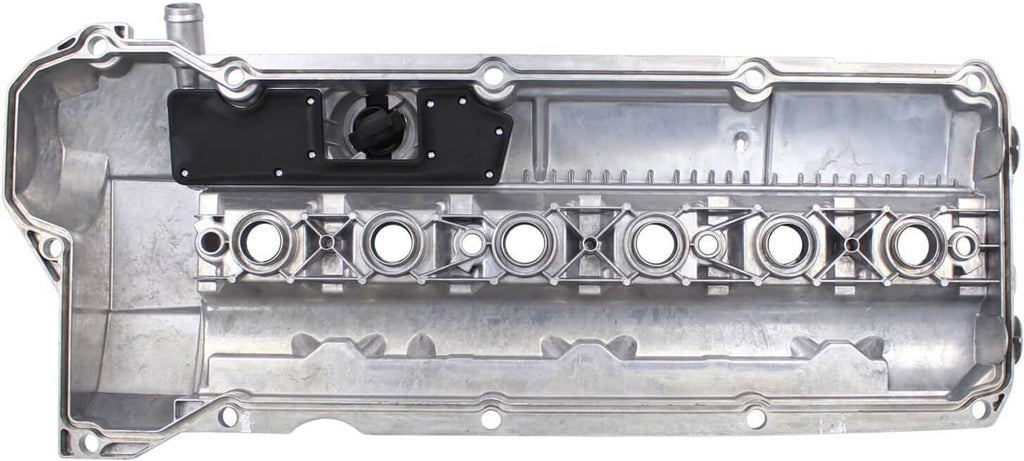 Valve cover gasket side with long internal channels and circular port openings