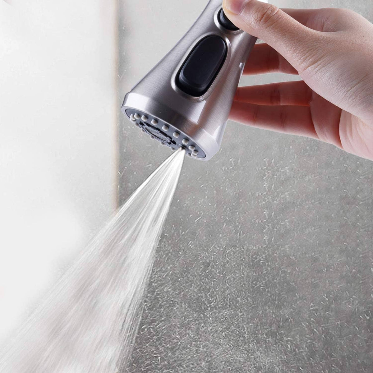 Pull-down spray head in use, delivering a strong continuous water stream