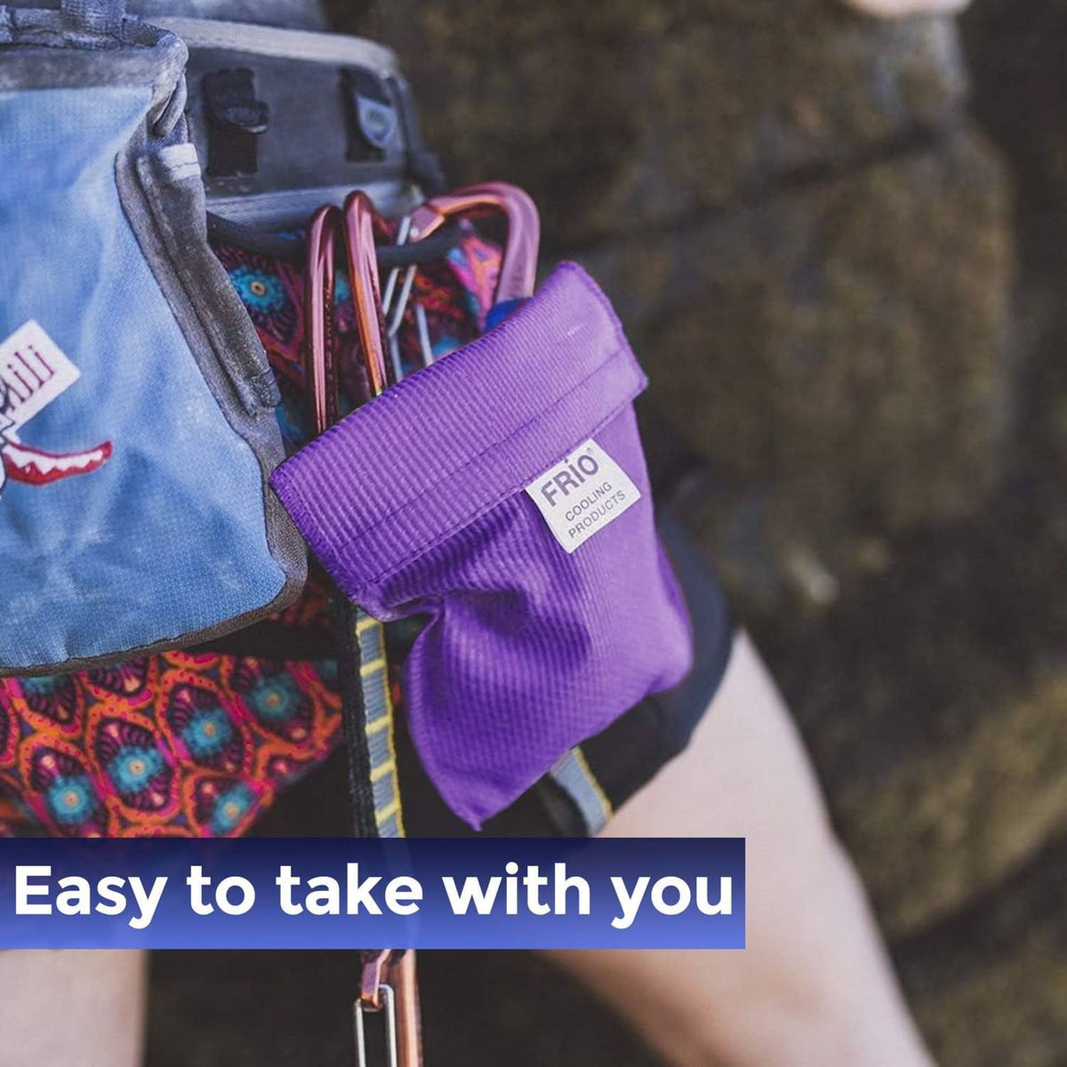 Purple FRIO cooling wallet with wide strap, partially opened to reveal inner insert