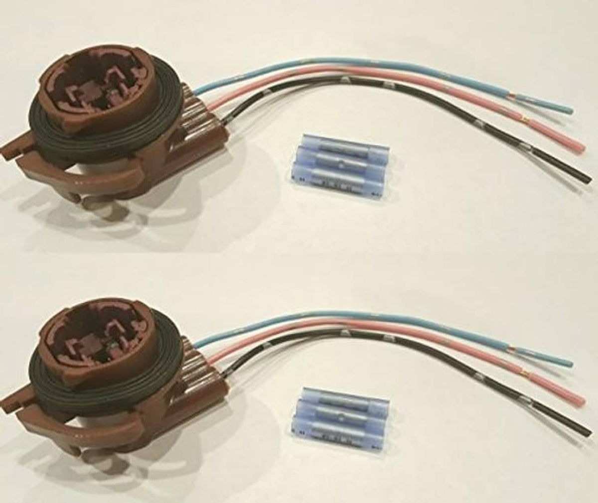 Two light socket pigtail repair kits with brown housings, blue terminal blocks, and colored leads