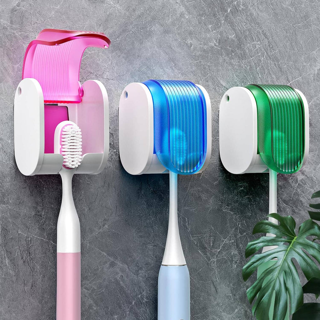 Single-slot toothbrush holder with pink cap and white base, holding a toothbrush