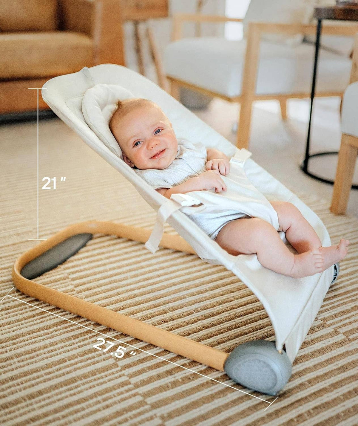 Lightweight baby bouncer seat with padded recline and rocker base, smiling infant