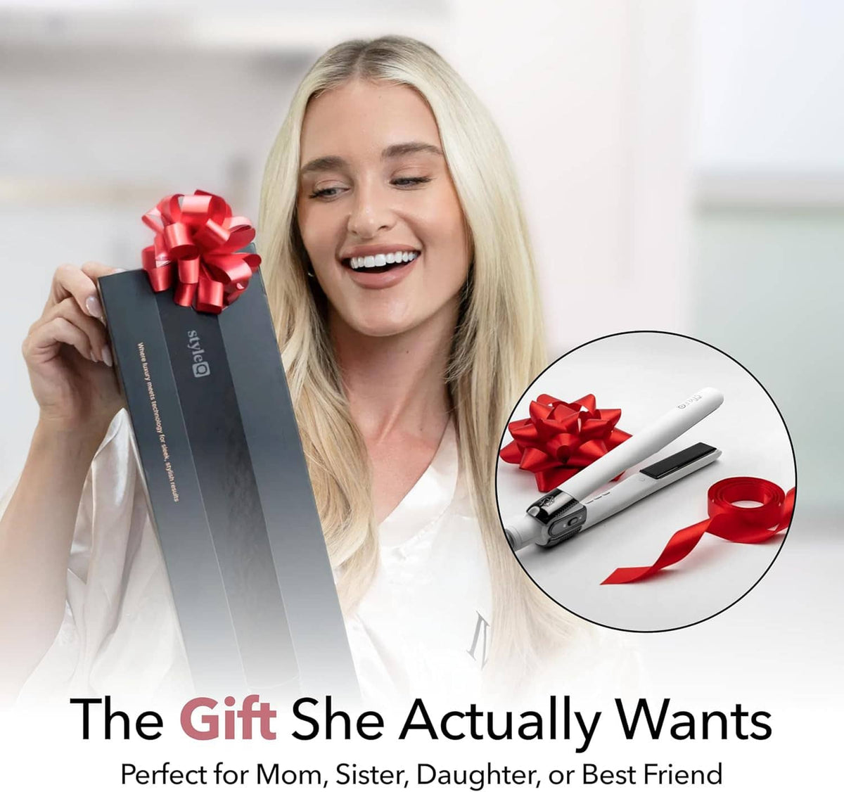 White hair straightener with red ribbon bow on a gift presentation.