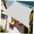 Light grey rectangle sun shade sail canopy over patio seating, stretched with corner grommets