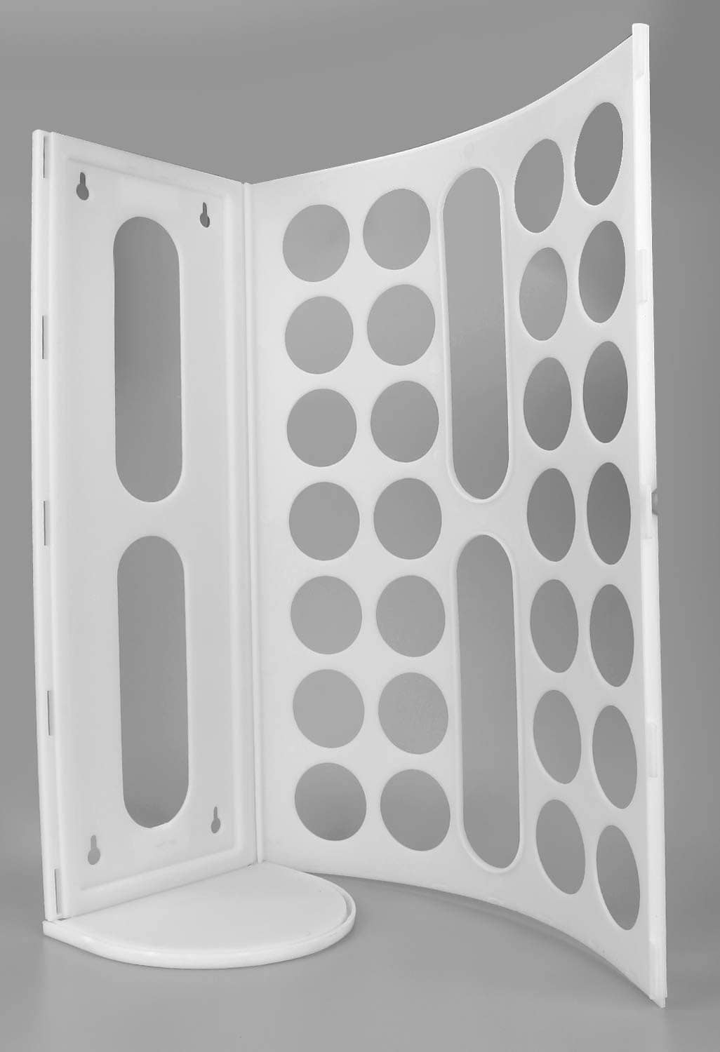 White foldable plastic bag holder with open panels and oval slots