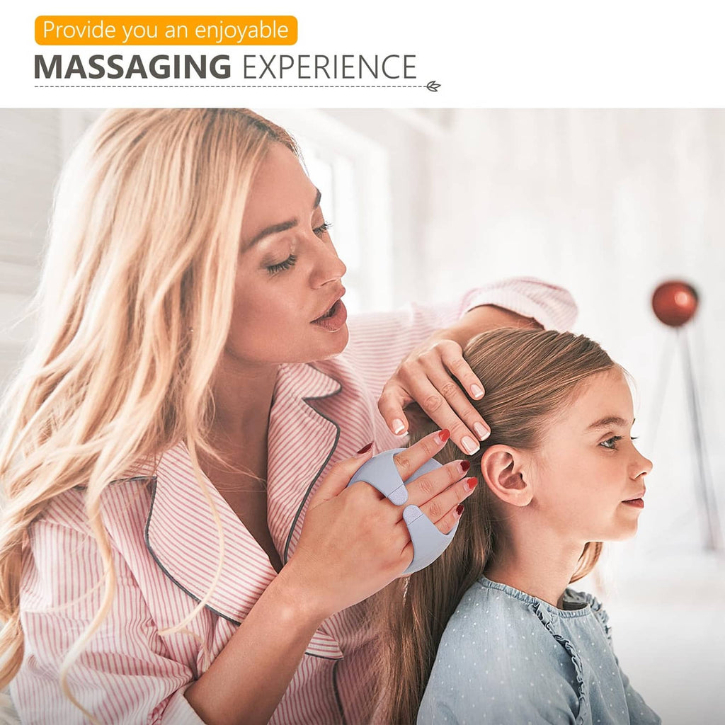 Sky blue scalp massager shampoo brush being used on a child’s hair