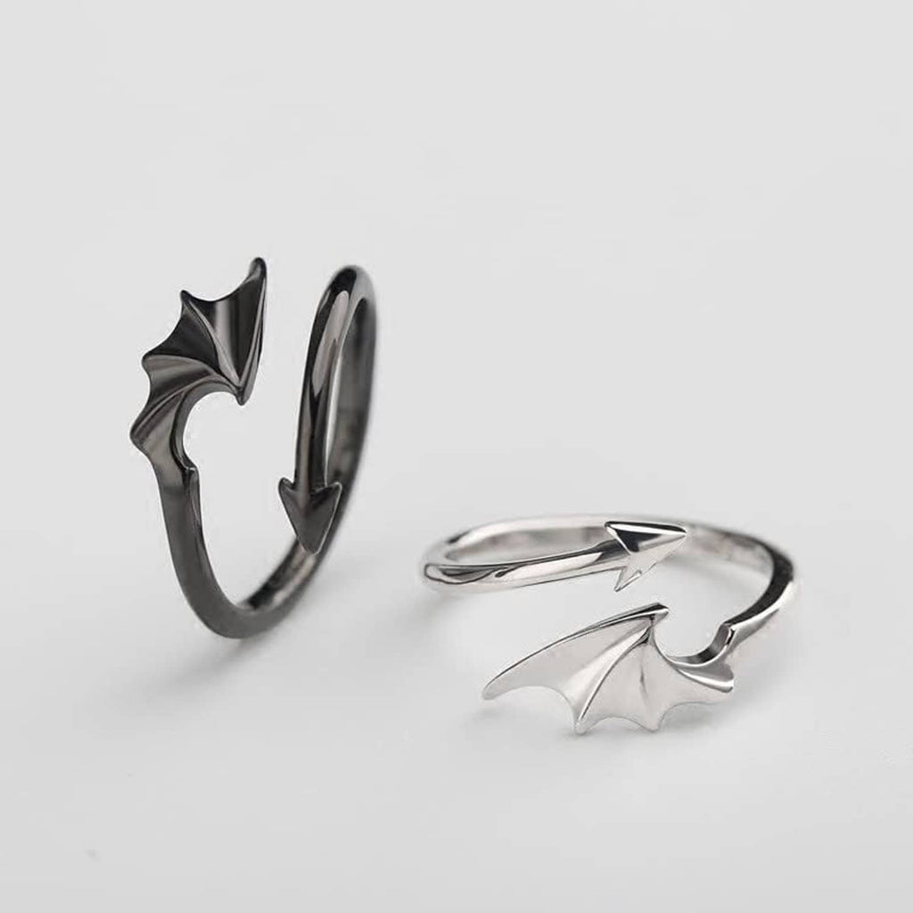 Silver bat-wing and lightning rings set shown on a light background