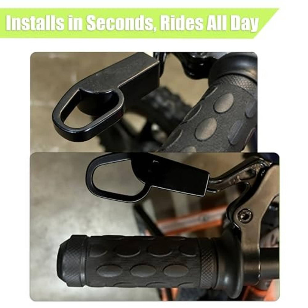 Black brake lever extender installed beside textured handlebar grip on balance bike.
